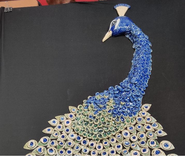 Detail of collaborative school peacock mural project